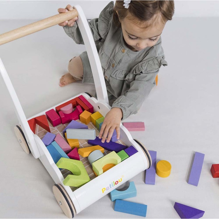 PL102-rainbow-cloud-walker-girl-placing-blocks-inside-storage-compartment.jpg