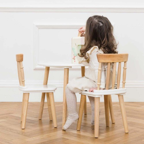 TV603-girl-playing-with-wooden-toy-on-the-table-and-chairs.jpg