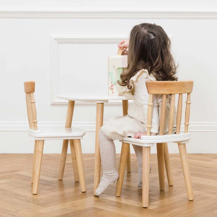 TV603-girl-playing-with-wooden-toy-on-the-table-and-chairs.jpg